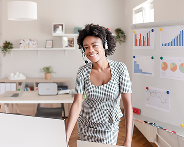 Woman employee in a headset WFH