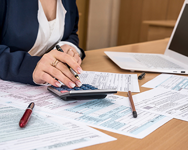 woman calculating taxes