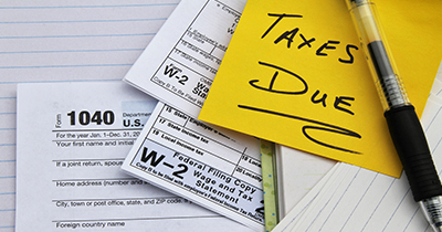 W-2 tax forms with Taxes Due reminder