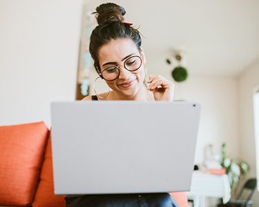 Woman sitting in front of a computer