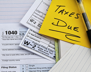 W-2 tax forms and a Tax Date reminder